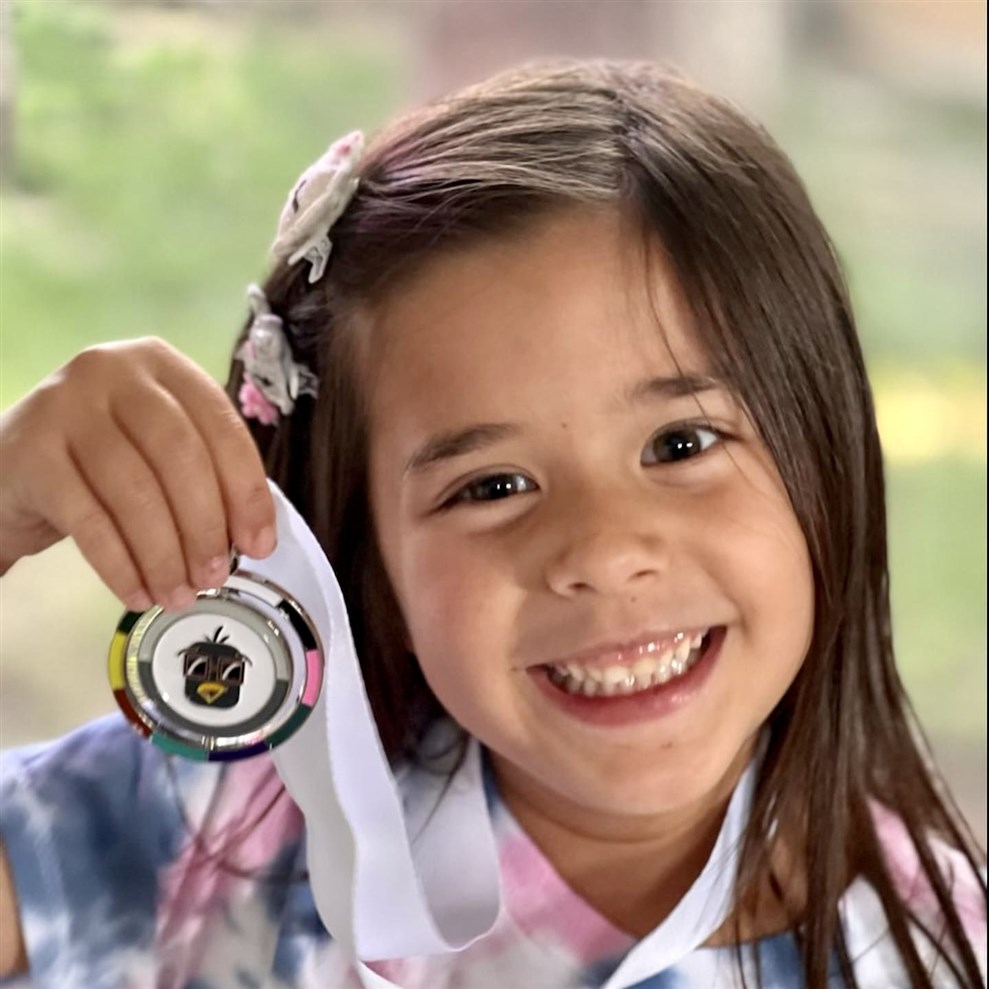 Young Music Achiever: Fort Worth's Music for Toddlers Student Proudly Holds Medal